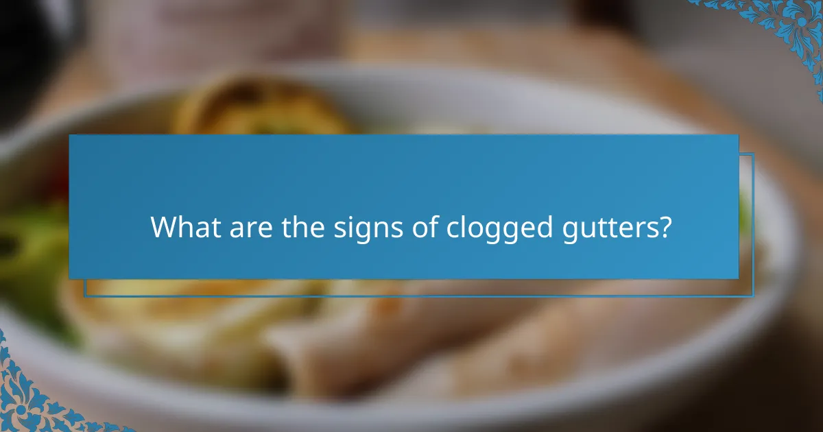 What are the signs of clogged gutters?